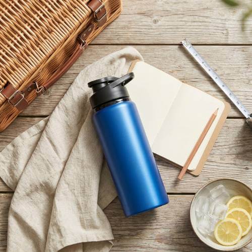 blue reusable bottle flat lay
