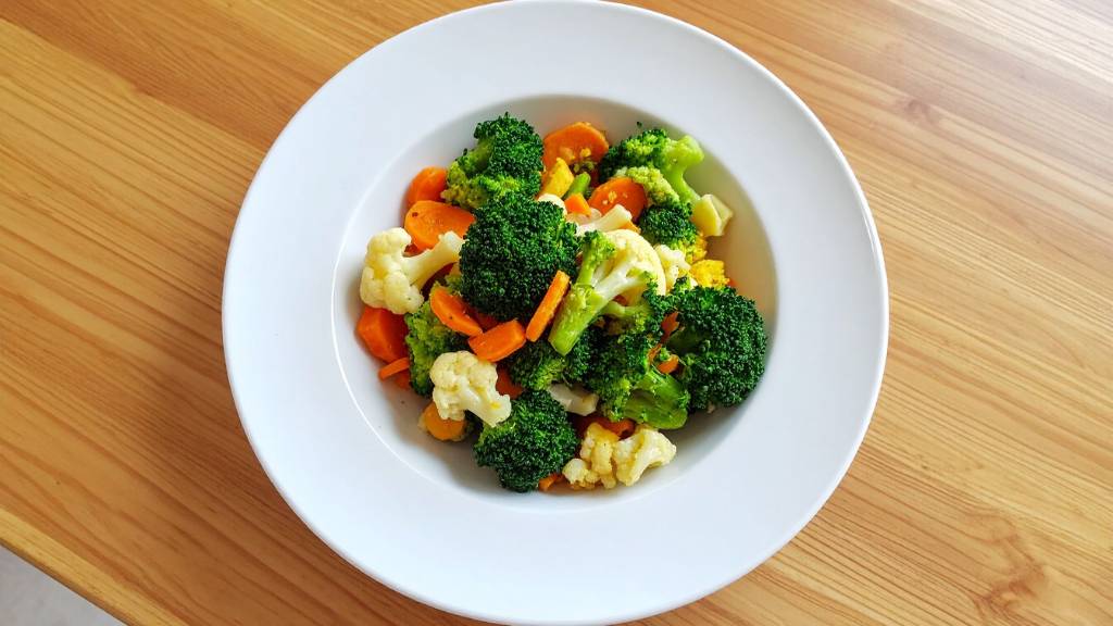 Steamed broccoli and vegetables in bowl for food theme ideas