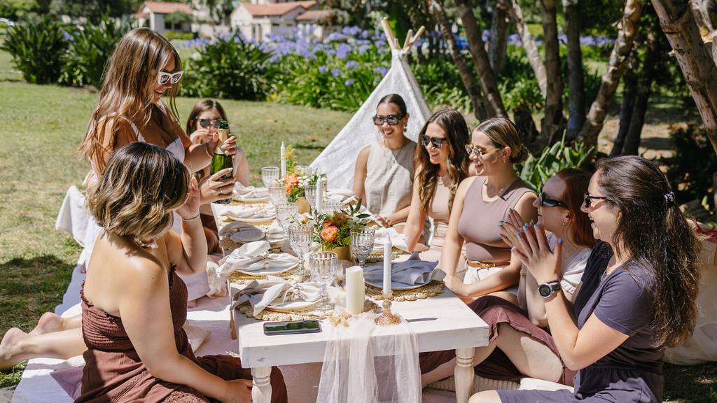 friends enjoying outdoor luxury picnic