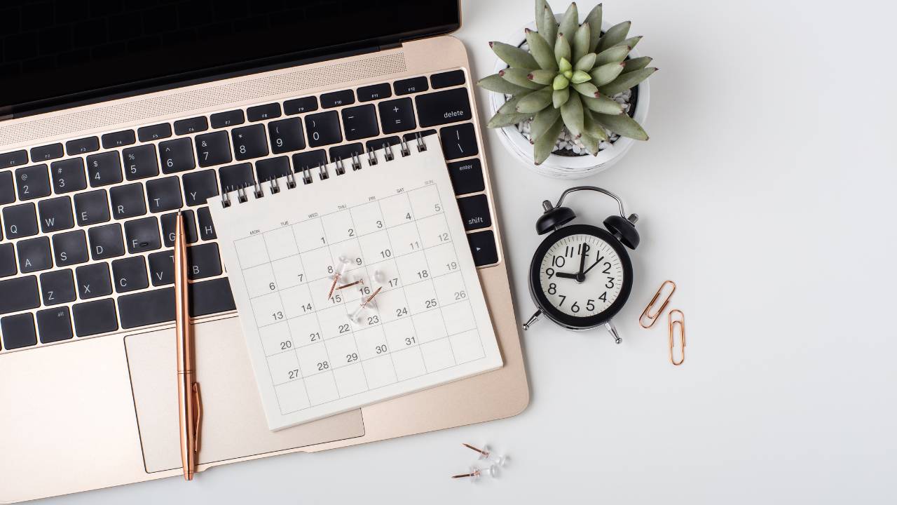 modern workspace with planner and laptop