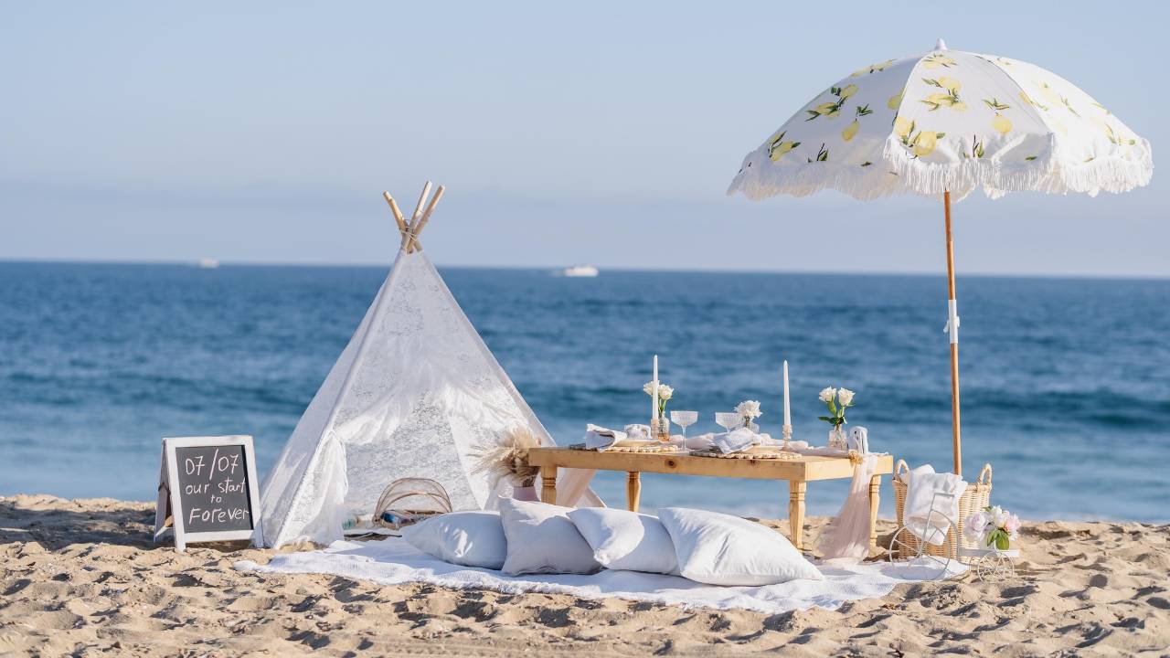 romantic beach event branding setup