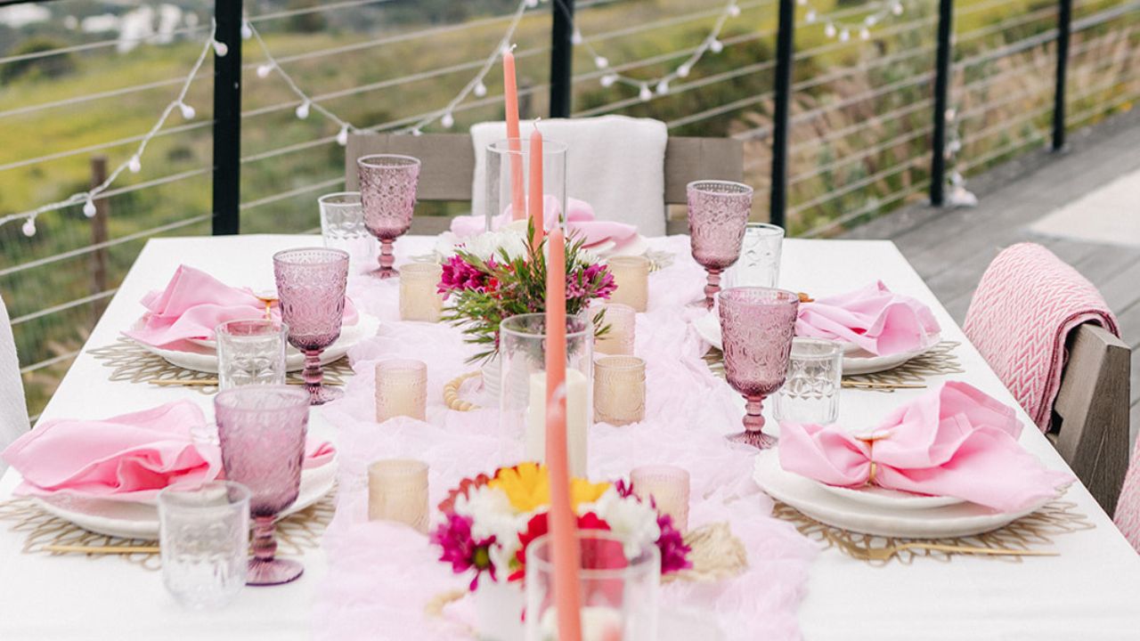 elegant outdoor table setting with white charger plates
