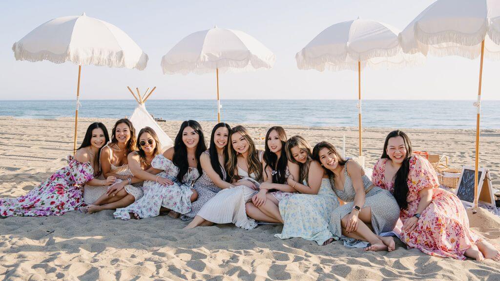 women relaxing at a beach picnic